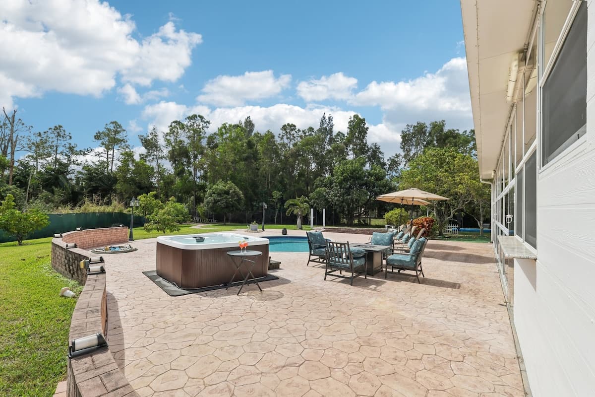 Fully fenced backyard with private pool, hot tub, and plenty of safe outdoor space for pets to run and play